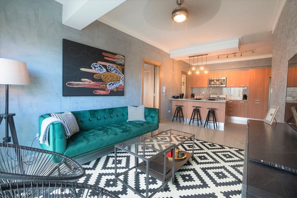 The Spacious living room comes with an open kitchen and a private balcony + view