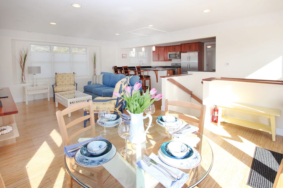 Upper-level eating, kitchen, and living area