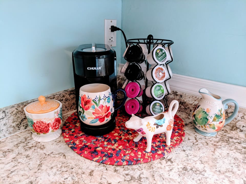 K-cup machine with k-cups AND coffee pot with filters and grounds