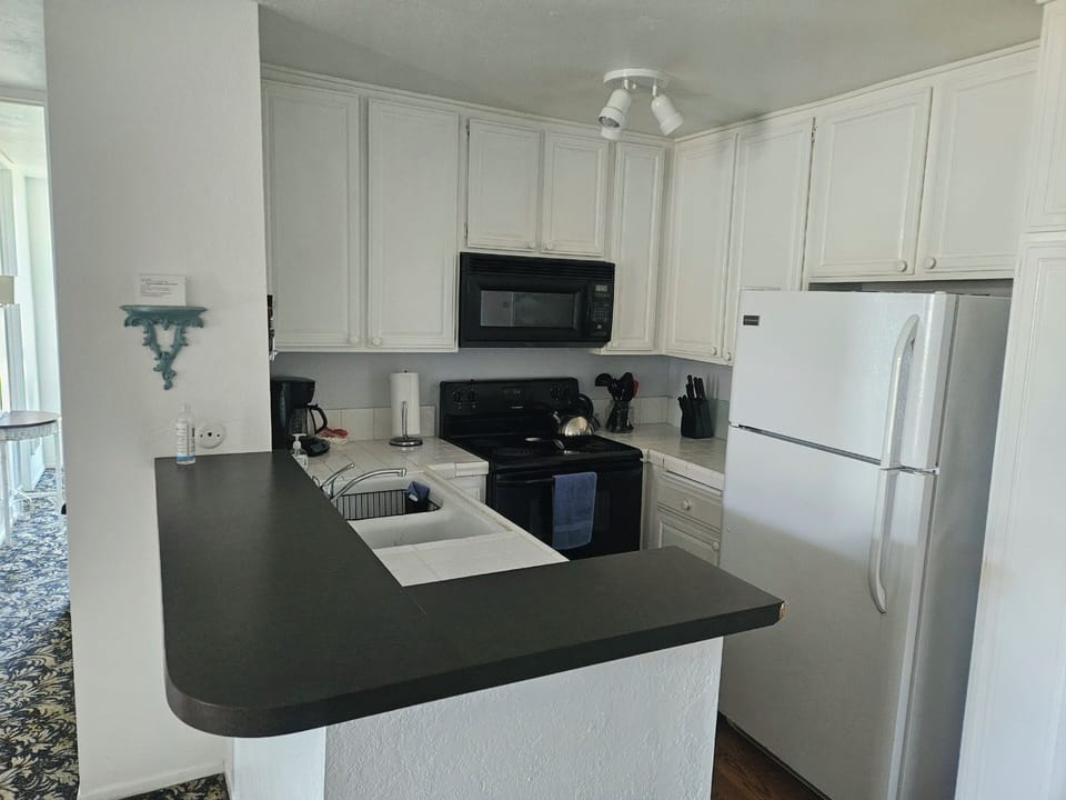 Kitchen counter is helpful for serving. Tried to stock kitchen with what you need on a vacation.