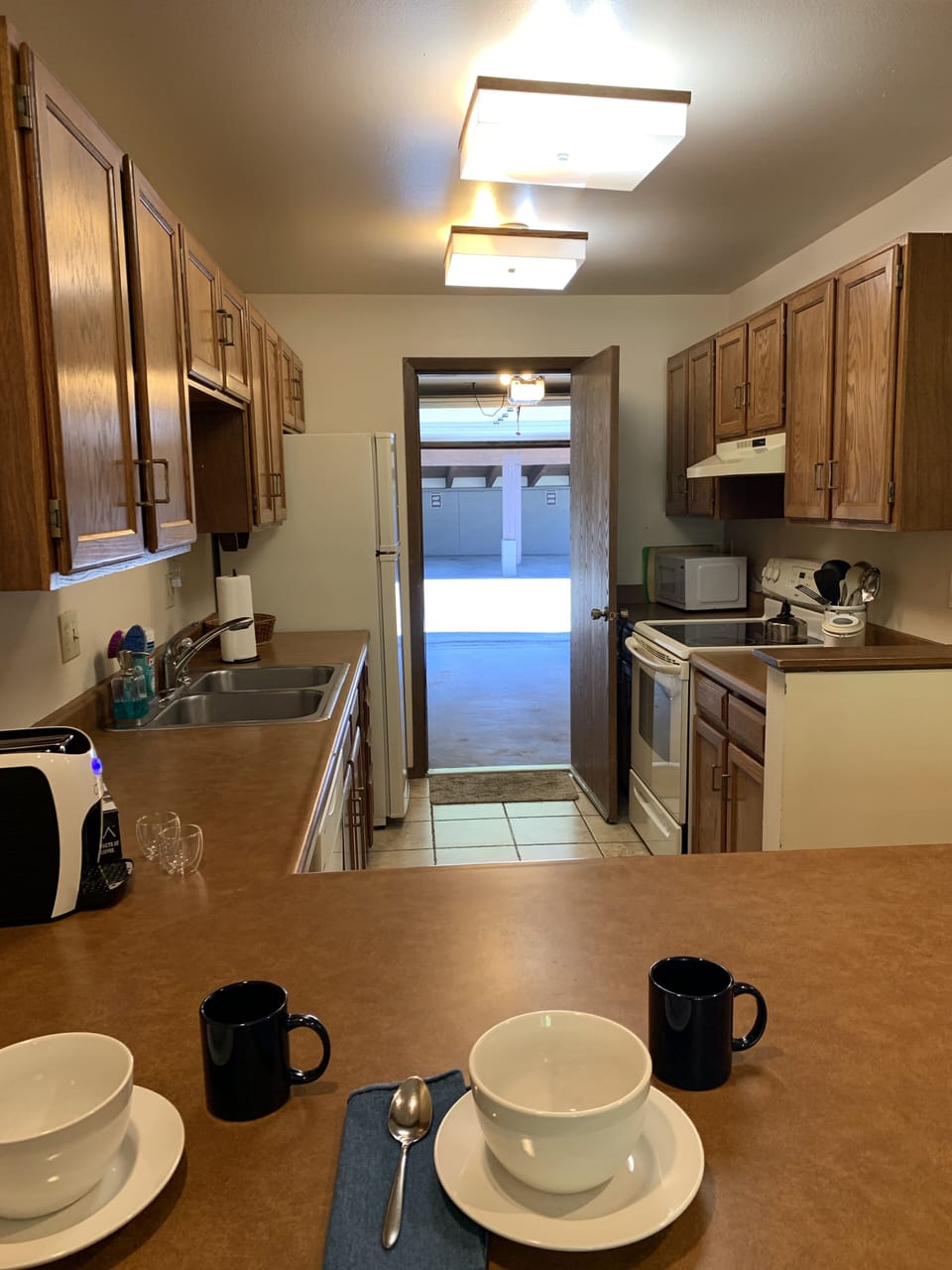 An attached garage space and an assigned carport spot are a big plus and rare!