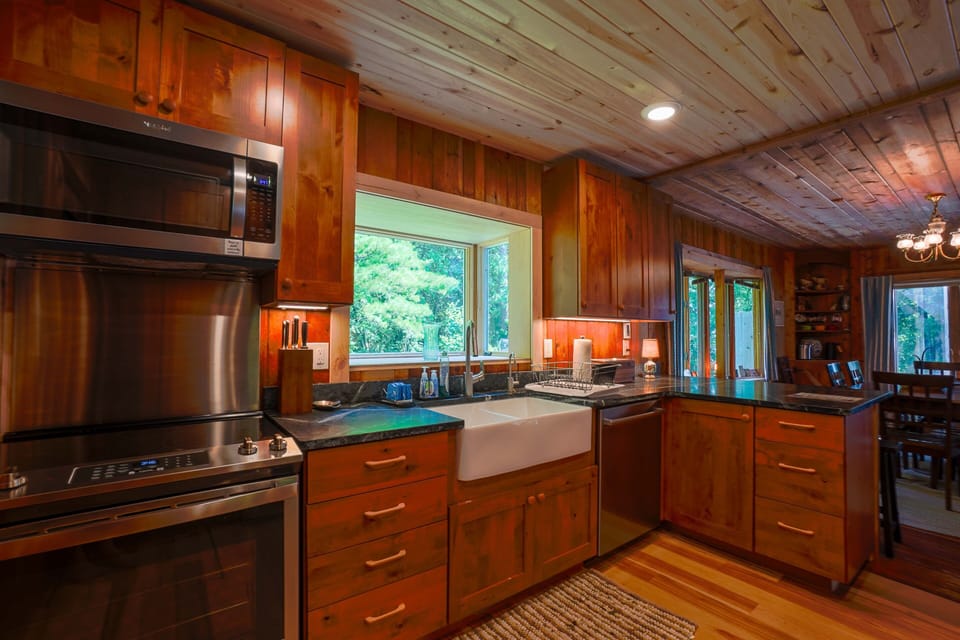 Range, microwave, farm-sink and dishwasher with lots of counter space