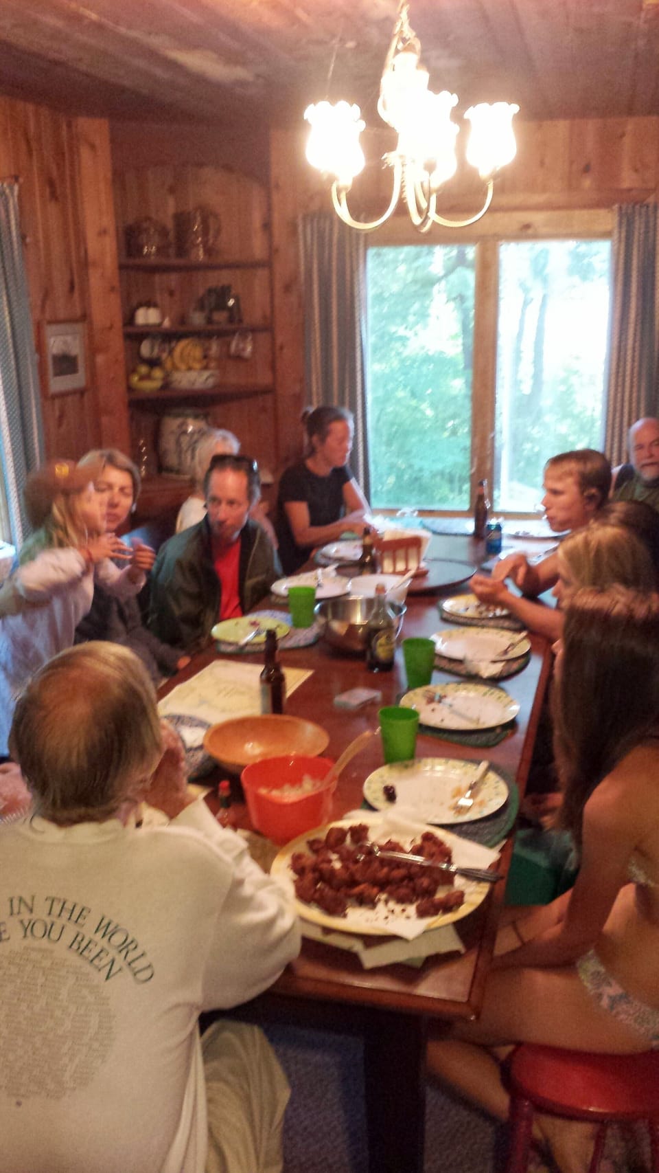 Family dining at the big table - or take your meals in the screened in porch.