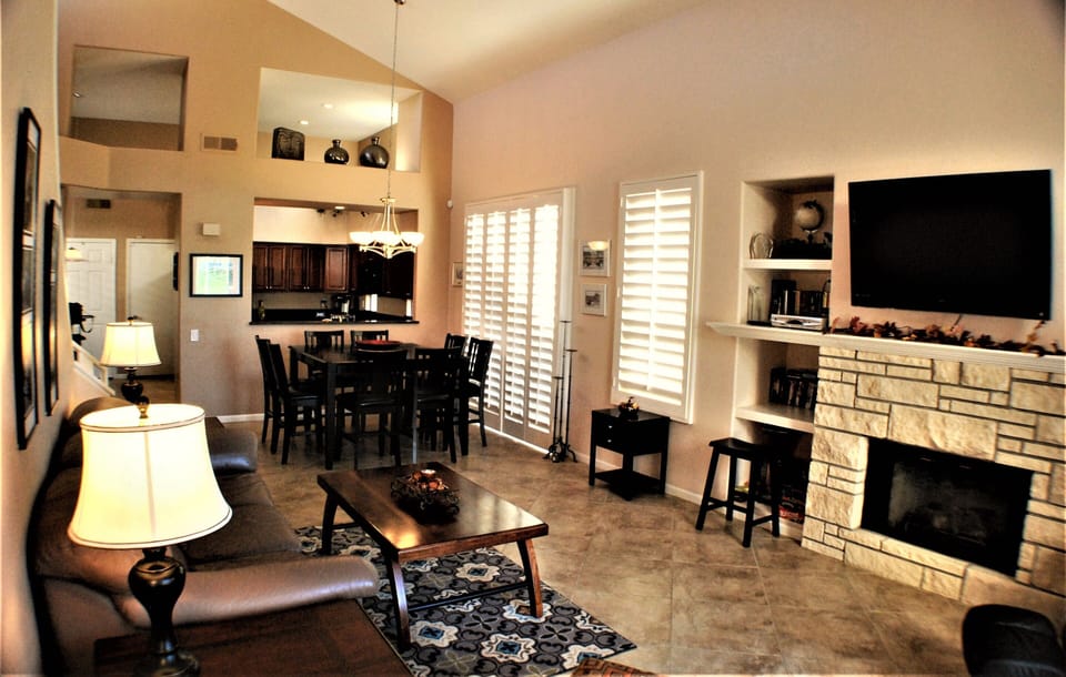 Spacious living room with sofa bed and fireplace