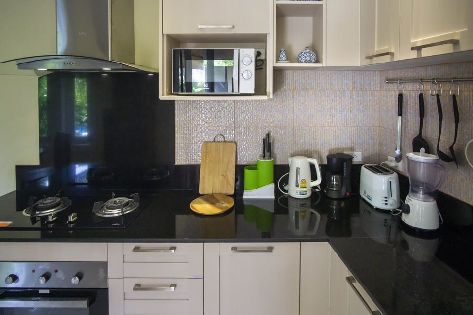 Kitchen has oven, gas hob, microwave, large fridge/freezer, blender, kettle, etc