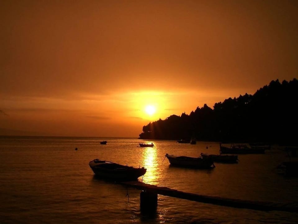Sunset in front of house