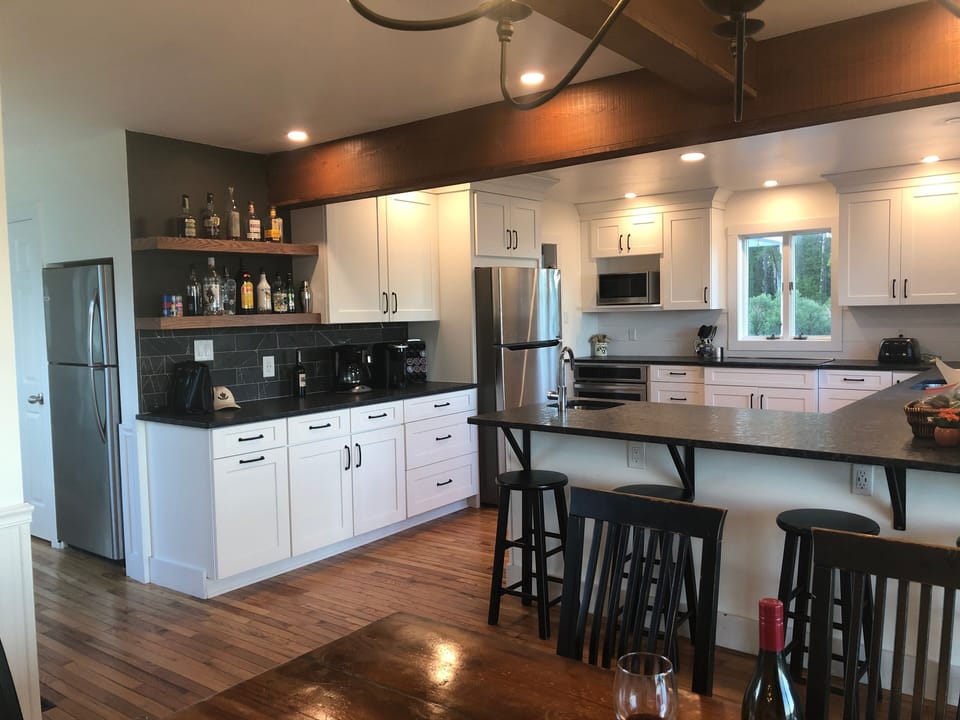 Newly renovated kitchen with two refrigerators and large pantry off the back.