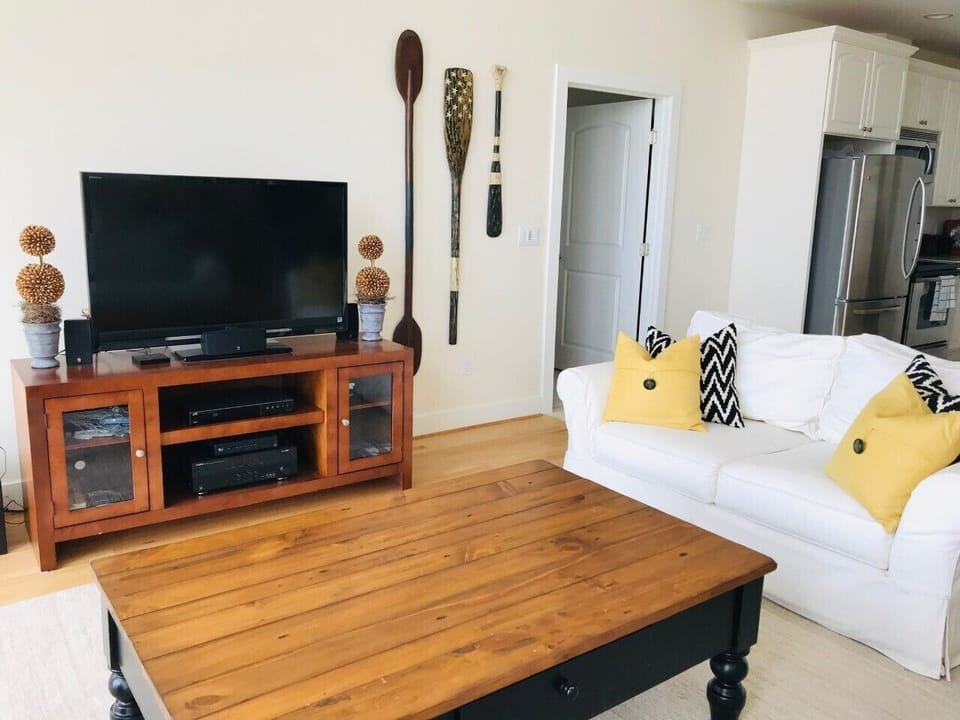 Main floor living room, seats six. AppleTV and variety of DVD movie options.  