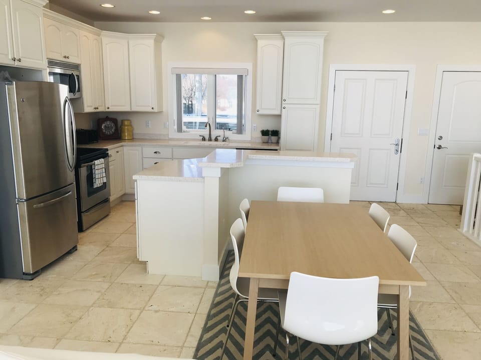 The "L" shaped island provides great space for food prep or for serving food.