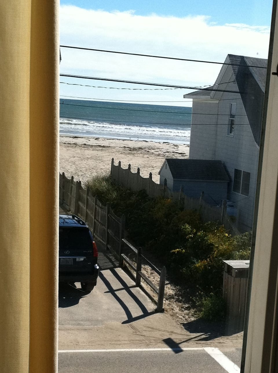 View of the beach and the public way from the front bedroom.