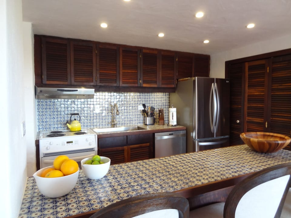 Updated kitchen with original hand painted Spanish tiles. 