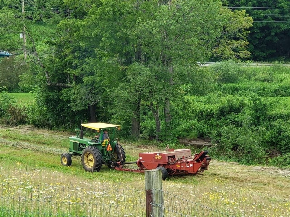 Farmer Bill can be seen working the farm or playing his fiddle on distant porch