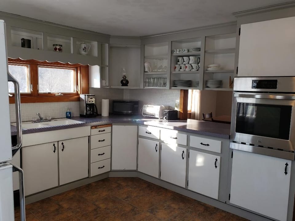 Country kitchen w/dishwasher.  Plenty of appliances to enjoy farm-to-table meals