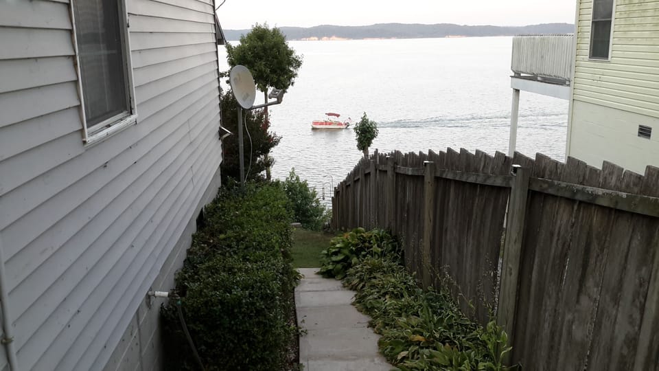 View looking toward the lake from south side  outdoor walkway.