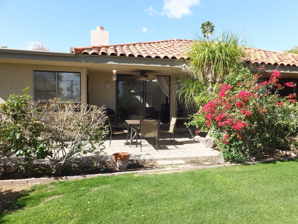 View of the patio which has a pass through window to the kitchen 