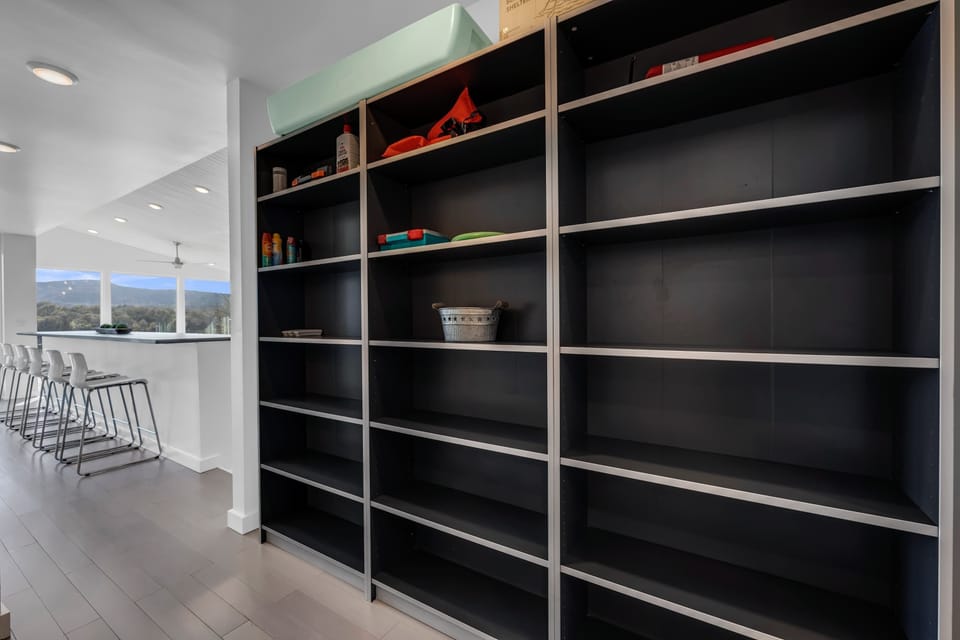 Hallway off of the kitchen with shelves for storage!