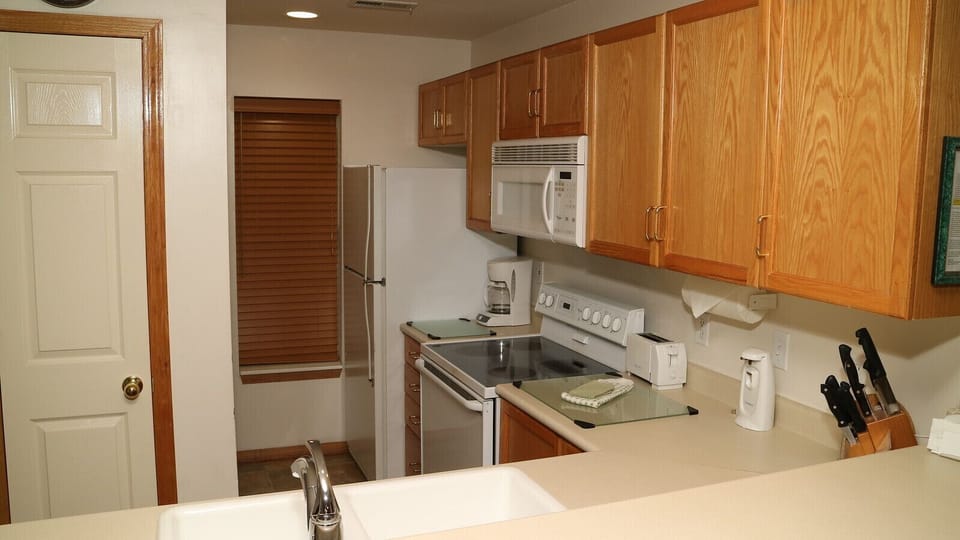 Kitchenwith glass top range, large fridge, dishwasher & washer & dryer