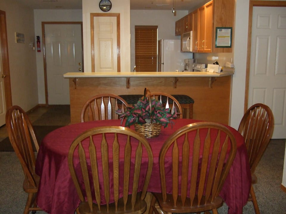 Dining room with kitchen in back ground