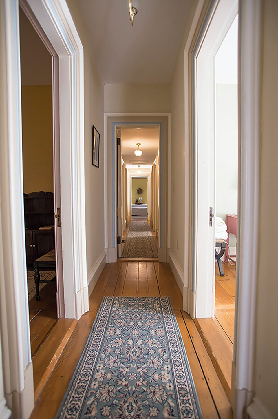 Upstairs looking down the hallway to room #6 at the end.