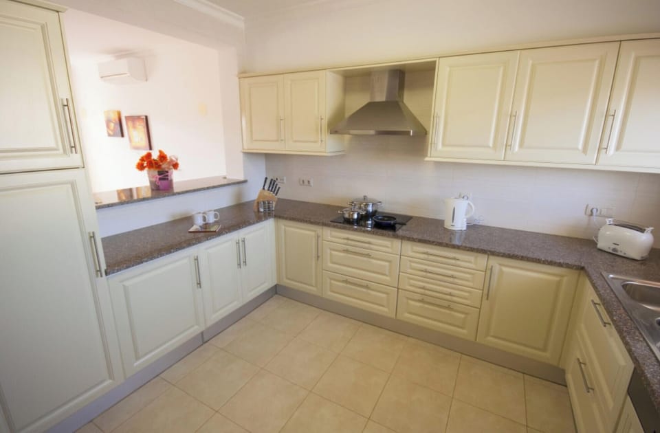 Fully Equipped Kitchen with opening to Living Area