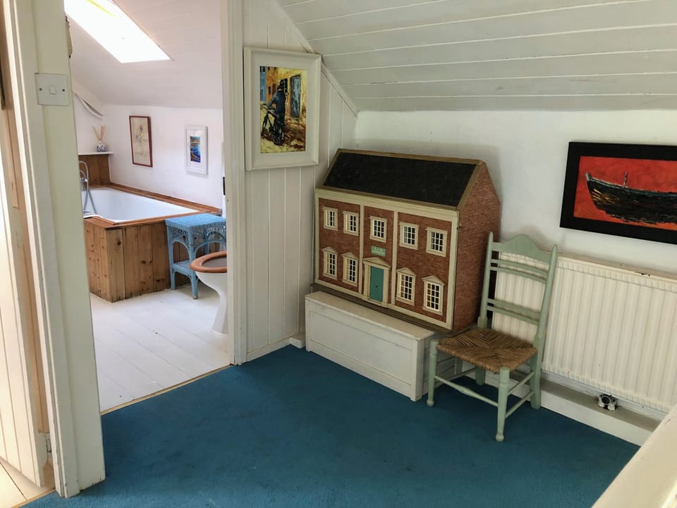 Dolls house on the landing outside bathroom 1