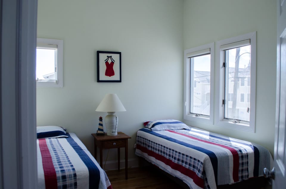 Second floor bedroom with two twin beds.