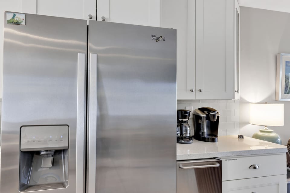 Ice maker to right of fridge; Keurig and drip coffee maker, grinder & filter