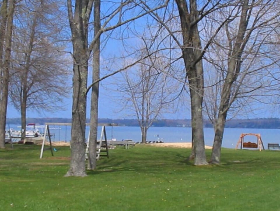 Common area with swing set and sand pile