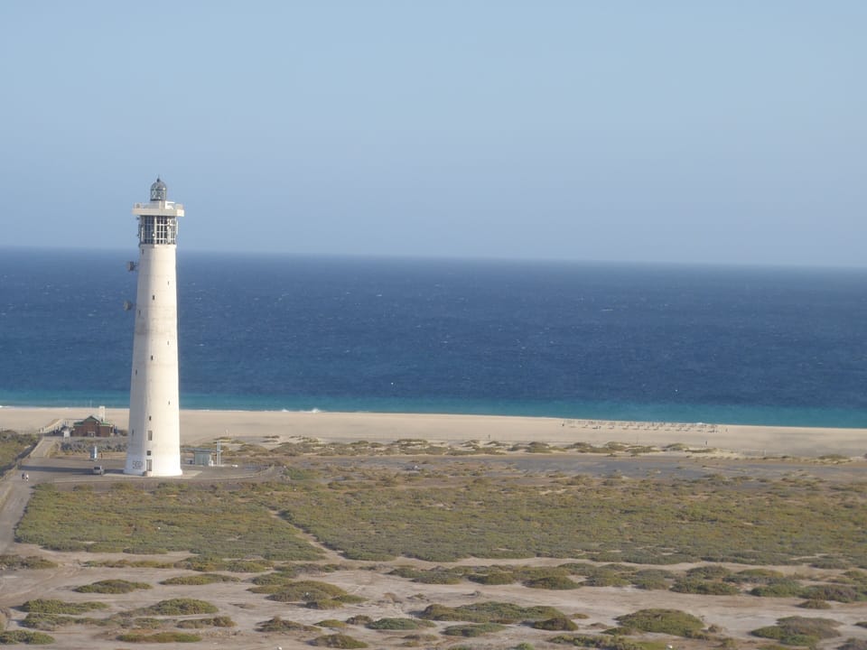 Jandia Lighthouse with the beach background 