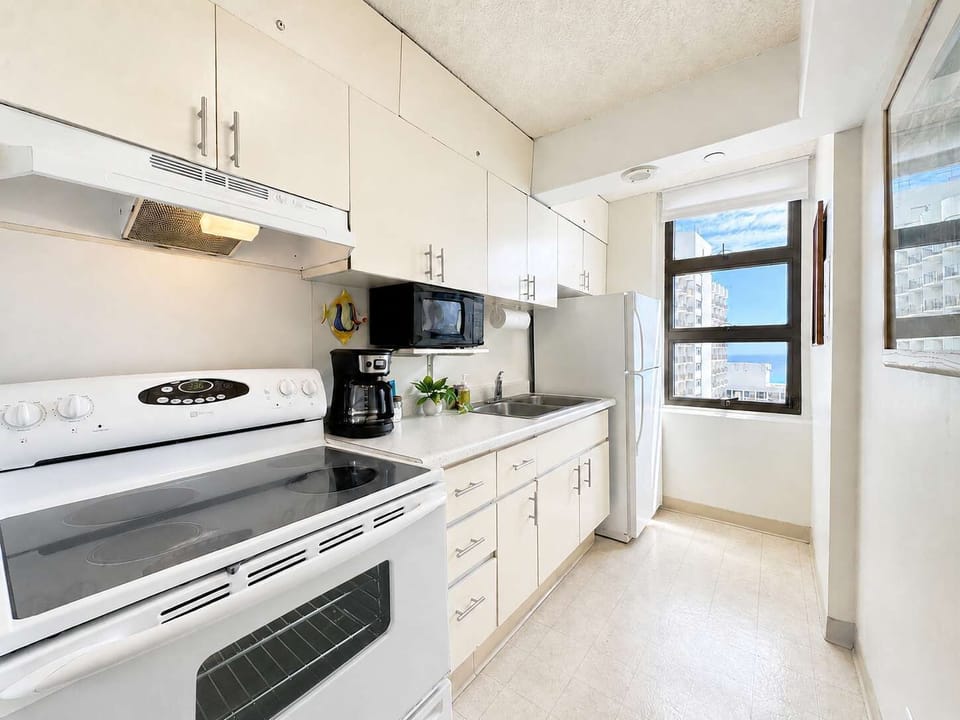 Prepare your favorite home-cooked meals in your clean, bright kitchen, complete with full appliances, ample storage, and a scenic ocean-view window