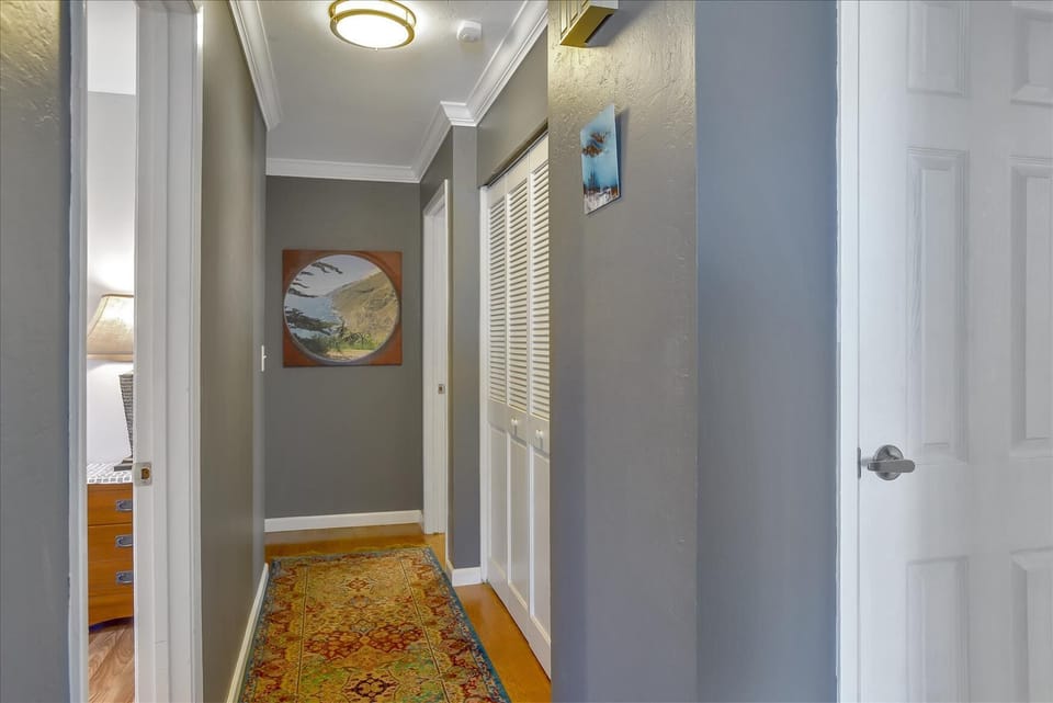 Hallway leading to laundry and bedrooms.