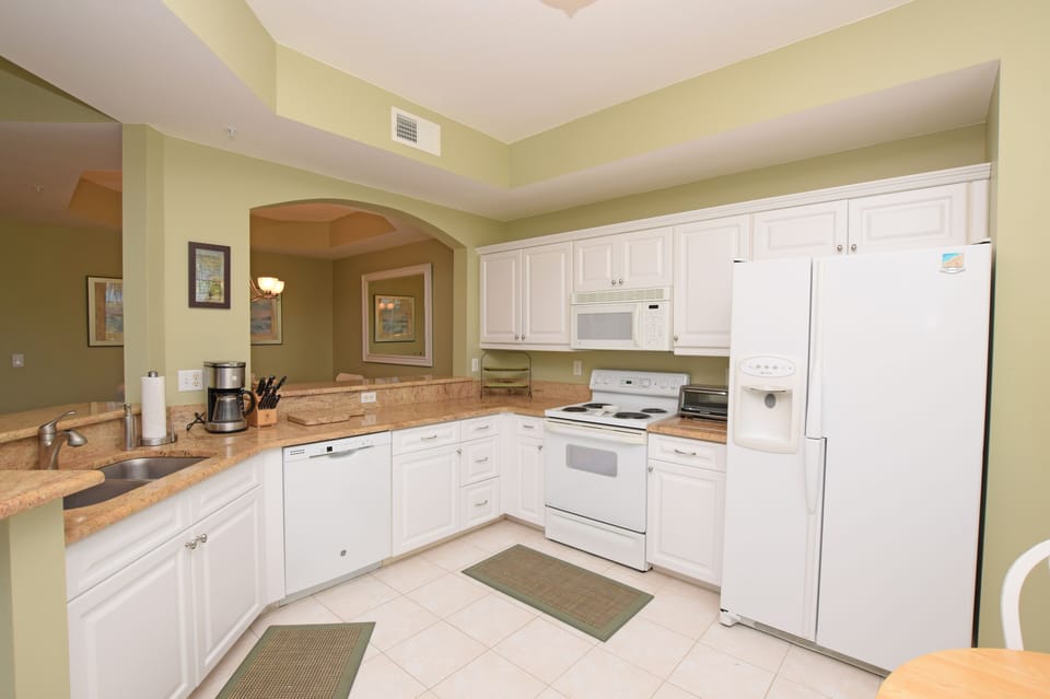This kitchen has all the comforts of home. Stunning granite countertops.