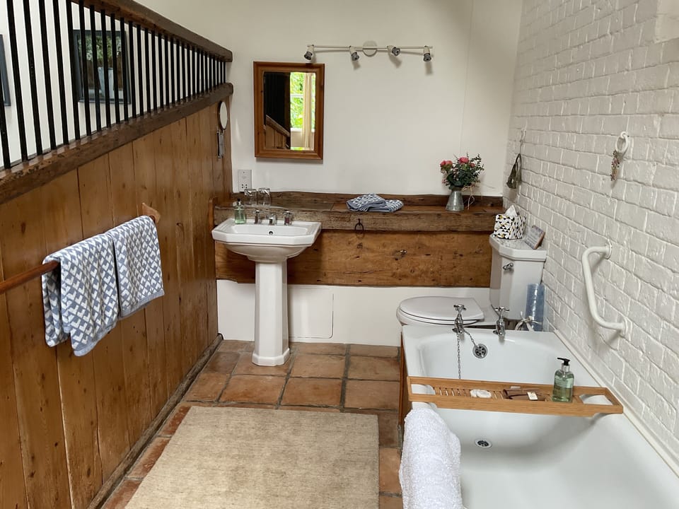 The old stable bathroom featuring the original manger