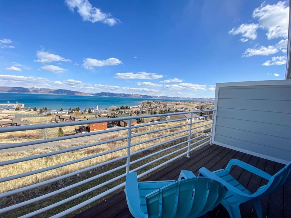 Relax on the balcony with panoramic lake views and fresh mountain air