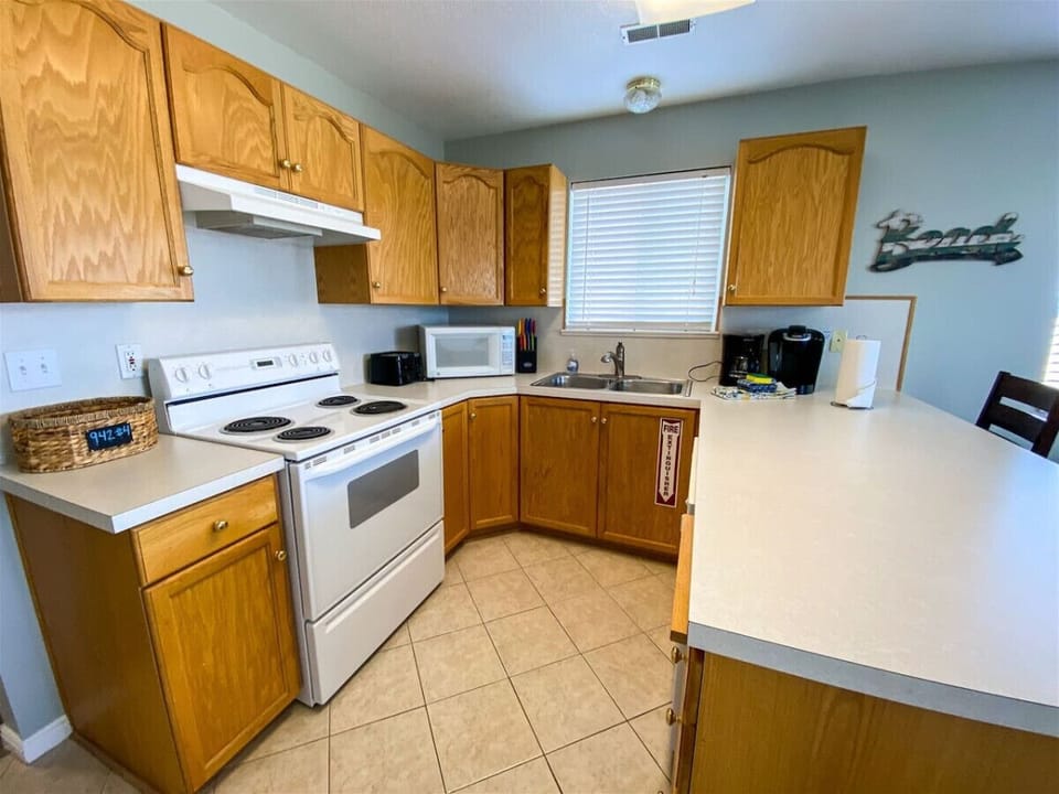 Fully equipped kitchen with ample counter space and modern essentials