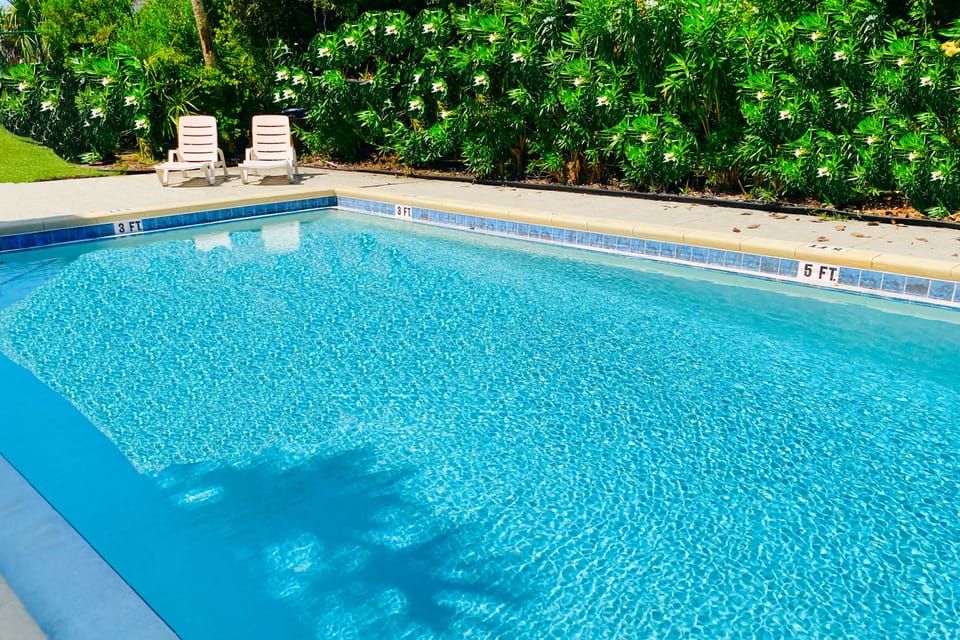 Community amenities: Pool, grill, laundry, outdoor shower, & fenced garden!