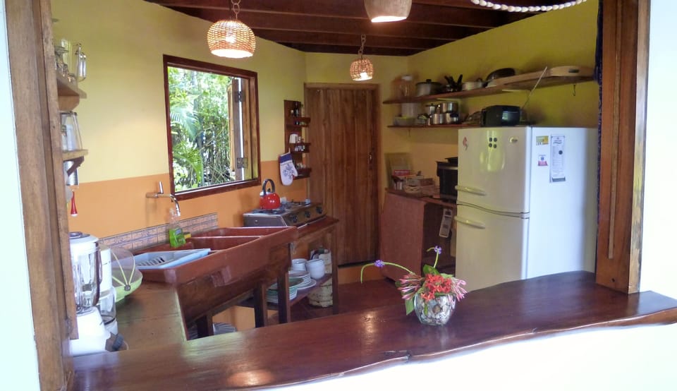 Kitchen with bar to the patio