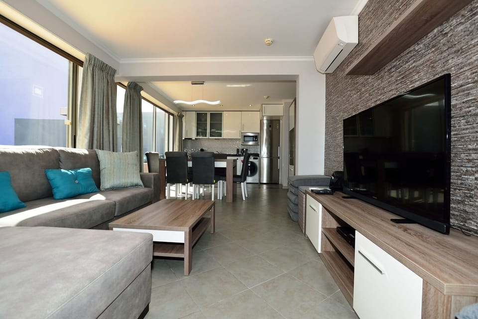 Living Room with 50 inch HD Television and cable channels