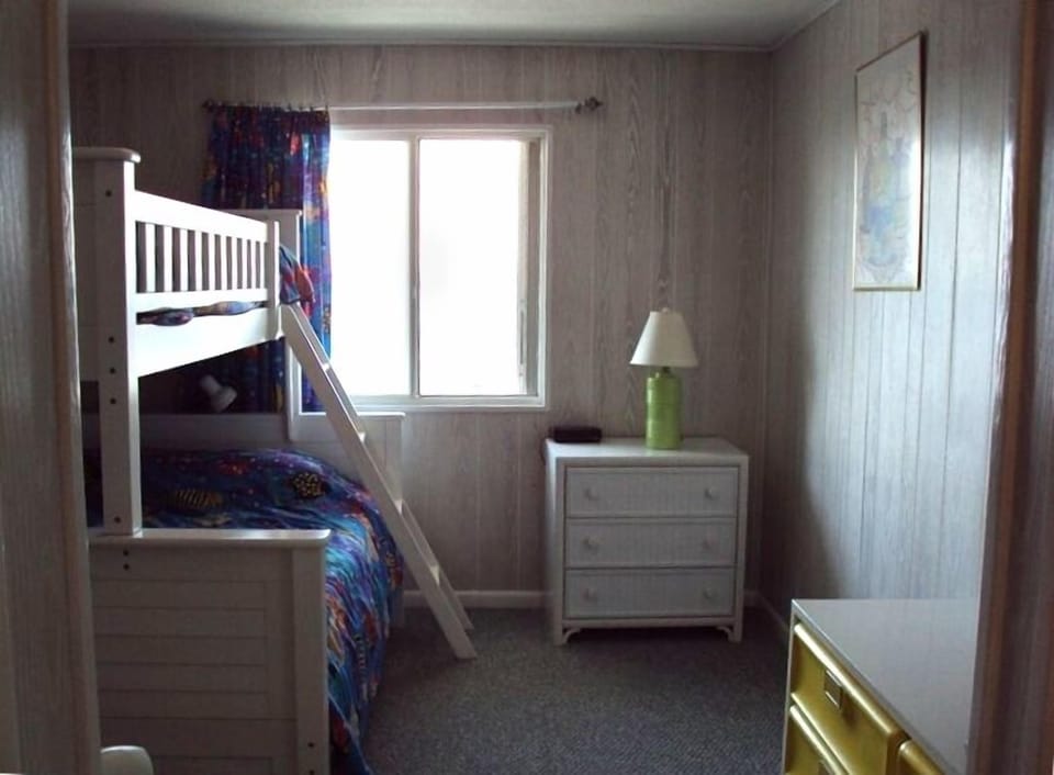 Bedroom with Bunk Beds, Twin over Full, with adjoining bath.