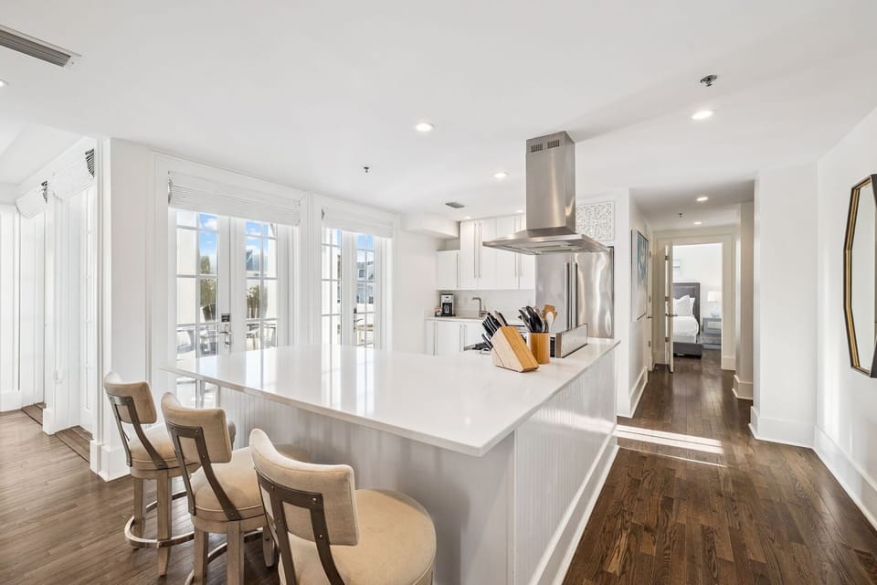 Whip up your favorite meals in this bright, modern kitchen featuring a spacious island and premium appliances.