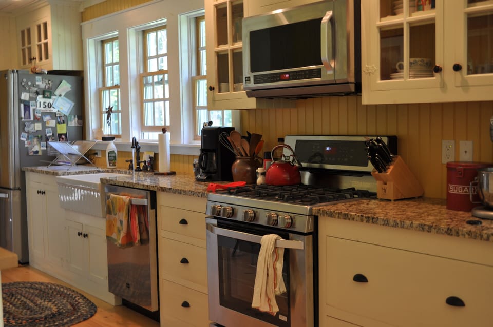farm sink, high-end stainless gas range, microwave, dishwasher and refrigerator