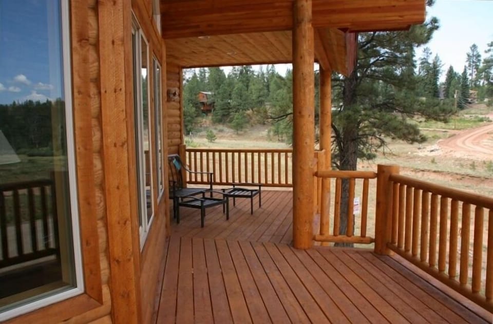 Deck extends across house to master room retreat w/ French doors
