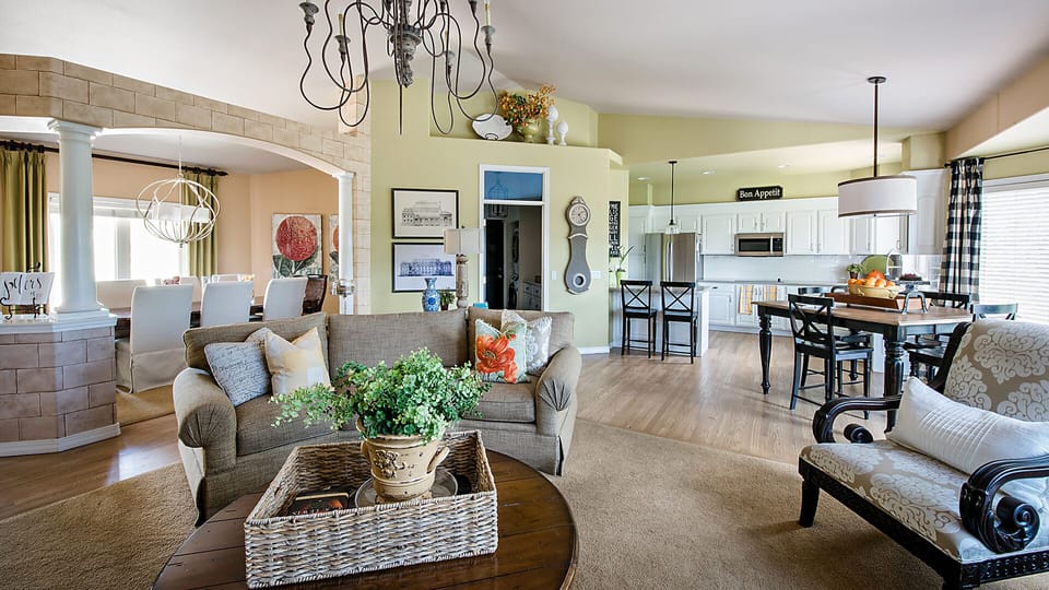 Looking from living room in the round to kitchen and dining room.
