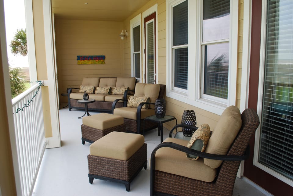 Plenty of seating on this large beach front balcony.