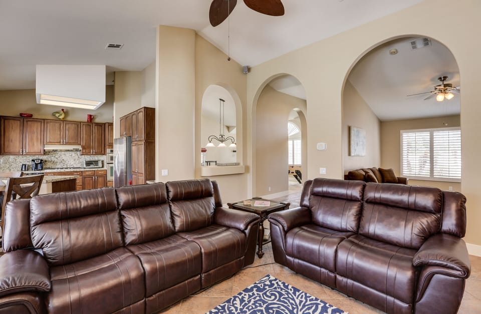 Third view of family room showing electric-reclining couches.