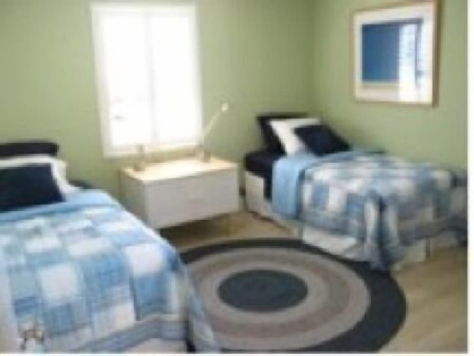 Twin beds in the third bedroom.