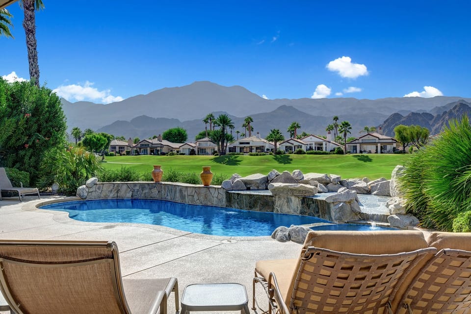 Relax Poolside with plenty of lounge chairs.