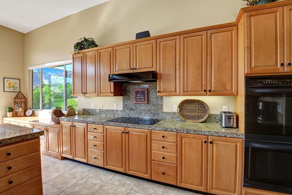 Double Ovens with plenty of cabinet space.