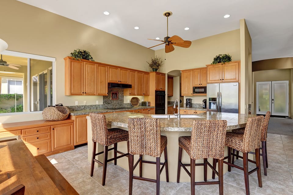 Fully Equipped kitchen with plenty of seating and cabinet space.
