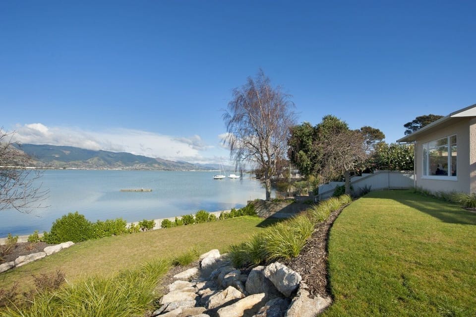 Landscaped terraced lawns lead you down to the waters edge
